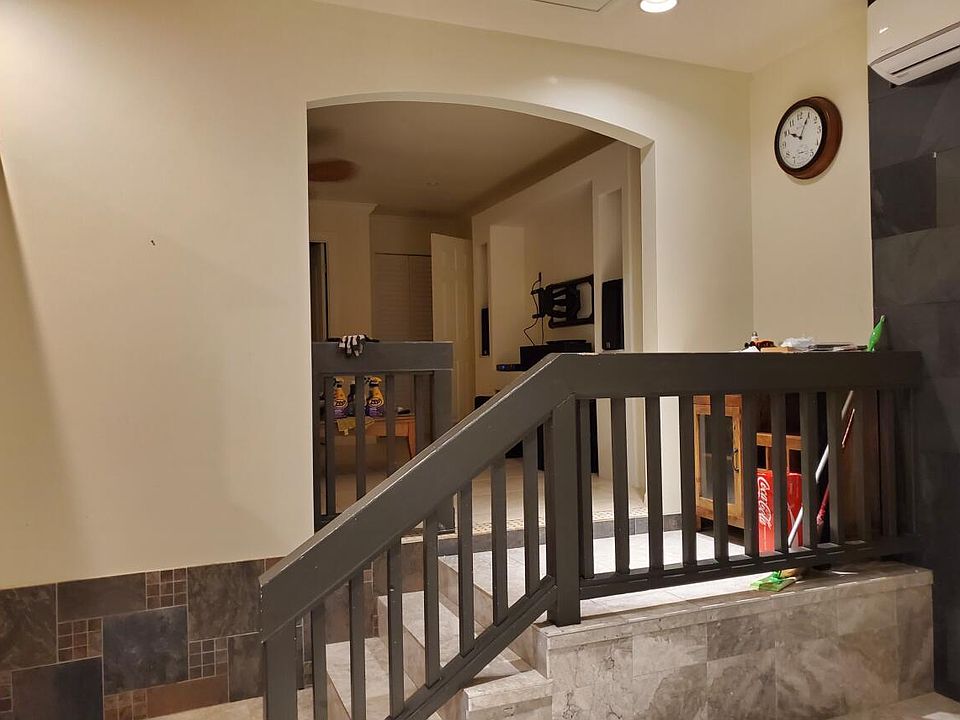 Stairs to TV/Living room and also going to full bathroom and bedrooms.