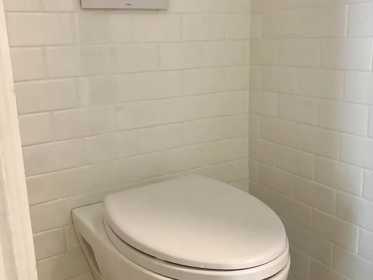 New in wall toilet.