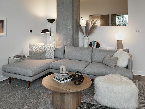 Apartment living room with wood-style flooring.