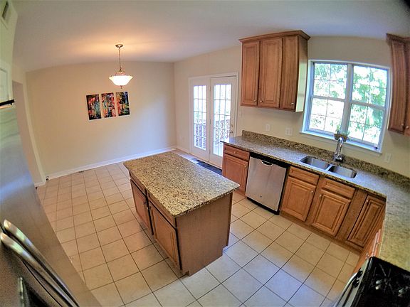 Kitchen next to dinning area and access to the deck