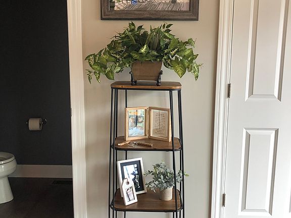 living space off the kitchen with 1/2 bath and on the right is full size washer and dryer behind the doors