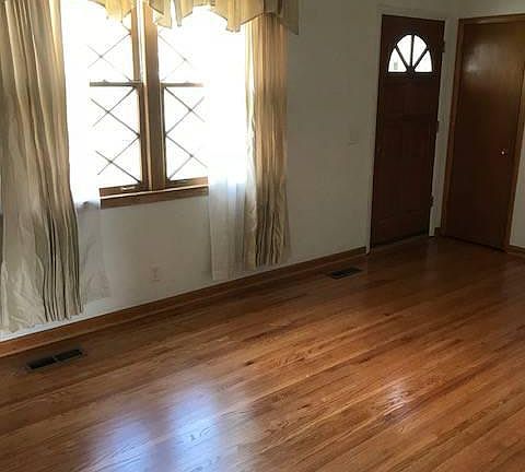 Living room with refurbished hard wood floors