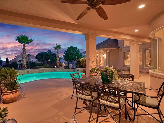 Enjoy the sunsets on the covered back porch of your back yard oasis.
