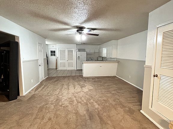 open concept living room that overlooks the kitchen