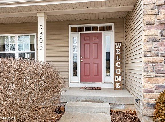 Welcoming front porch with a place for your table and chairs!