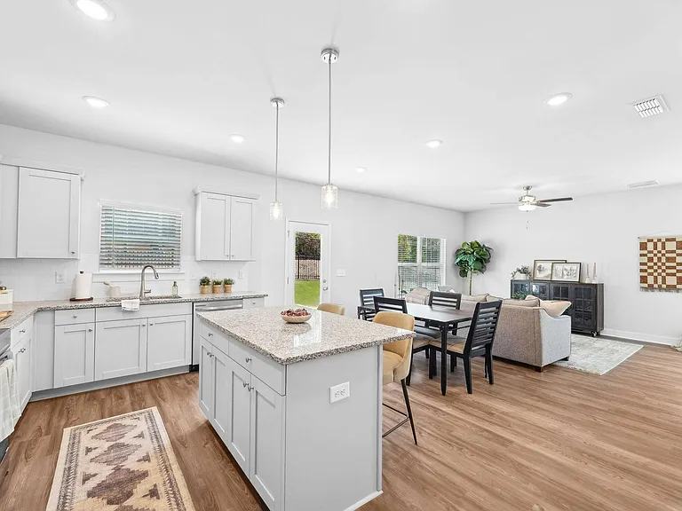 A view of the spacious kitchen and stainless steel appliances