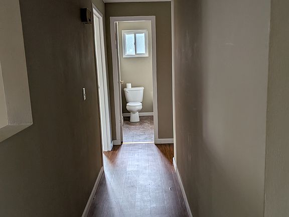 Hallway to bathroom and bedrooms