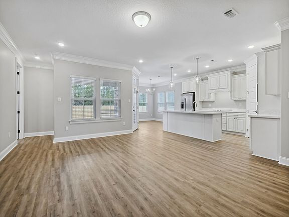 Great room in the Taylor floorplan at a Meritage Homes community in Gulfport, MS.