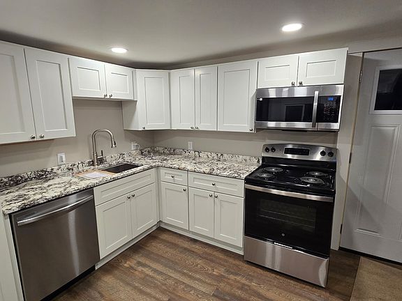 New maple cabinets with granite, DW, direct vented microwave hood