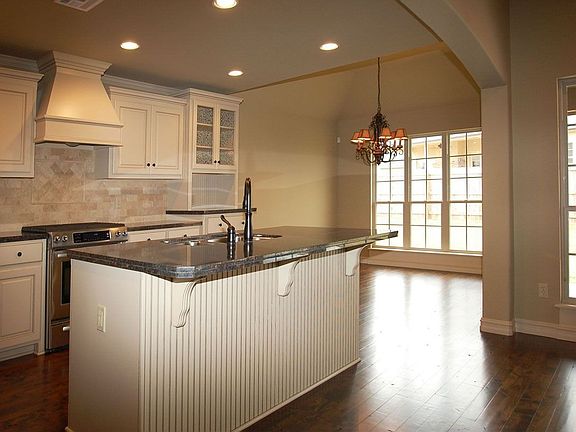Kitchen with granite counter-tops and stainless appliances