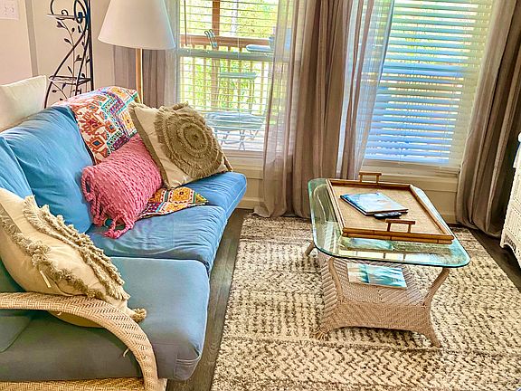 Studio style apartment. Open living room with comfy couches and TV