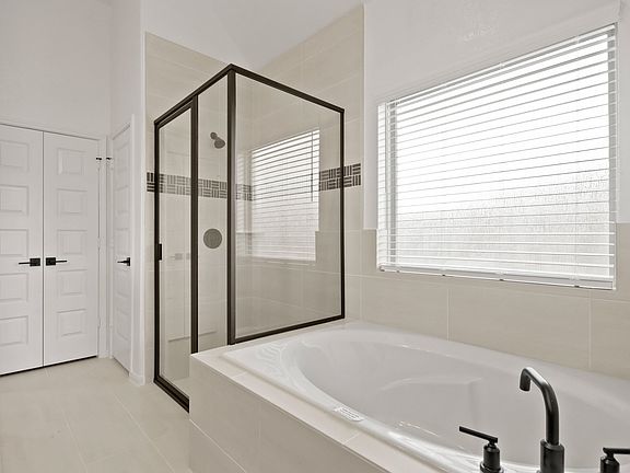 Owner s bath with soaker tub glass shower enclosure