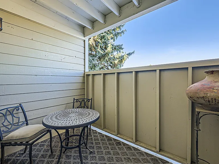 Step into your private outdoor haven with beautiful views and comfortable seating.