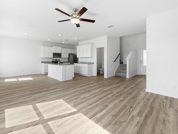 A foyer welcomes guests into a grand entertainment space