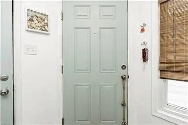 1st Floor Entry door and garage door to left. Closet also on this floor