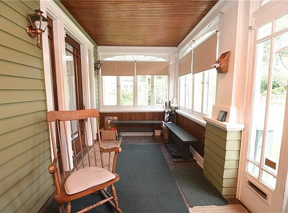 Enjoy the seasons on the enclosed porch.