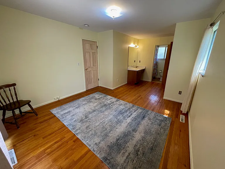 Third bedroom with its own bathroom and sink.