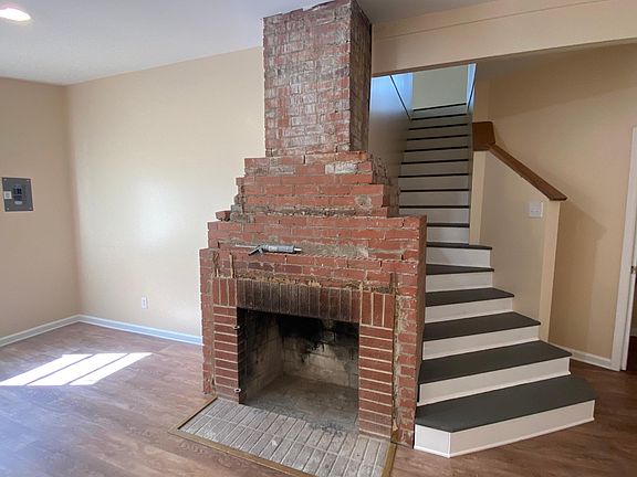 Living room with stairs to second floor