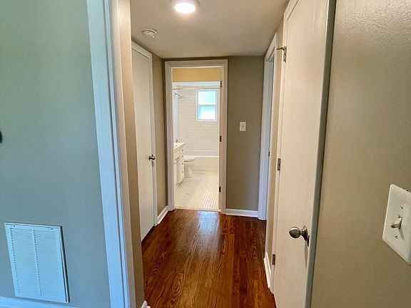 hallway with linen and coat closet