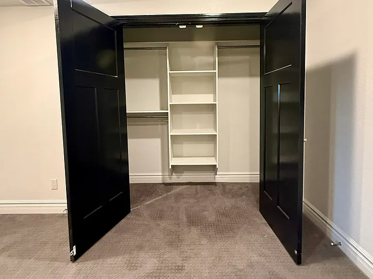 large closet with built in organizer