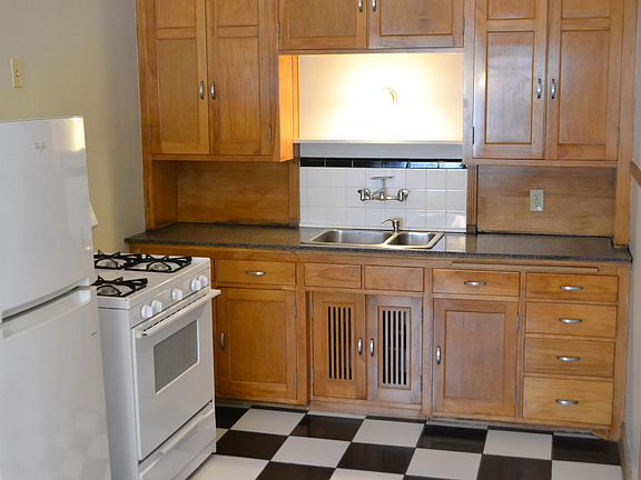 Classic birch cabinetry and a fun, checkered tile floor