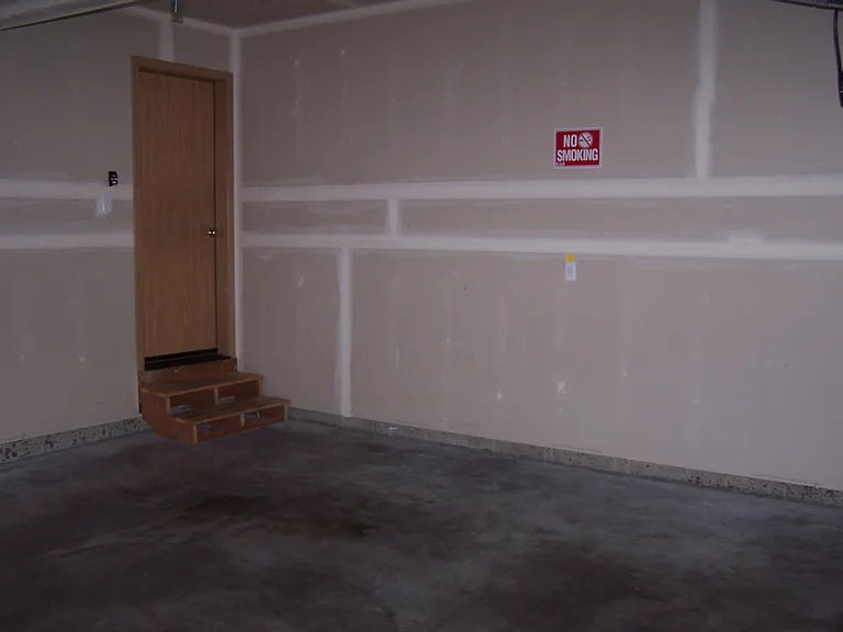 Two car garage with remote garage door opers.