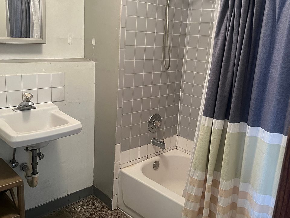 The bathroom will have a new vanity and fan. The other side has space for the stackable washer/dryer.