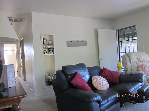 Living room view of front entry to bedrooms