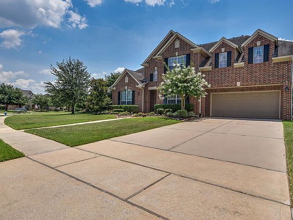 Three car attached garage and plenty of place on this wide driveway for your friends to park. The home is within walking distance to Frank Elementary.