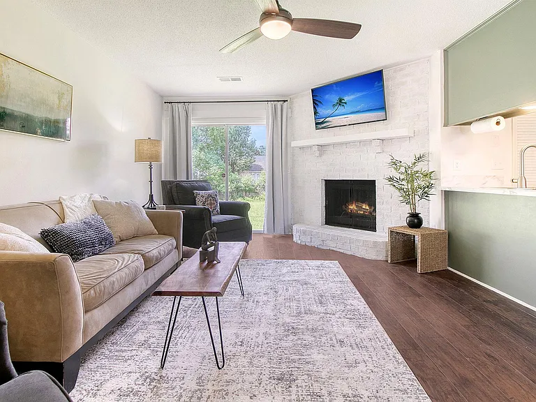 The cozy living area with 50" VIZIO flat-screen TV, is ideal for relaxation and entertainment.