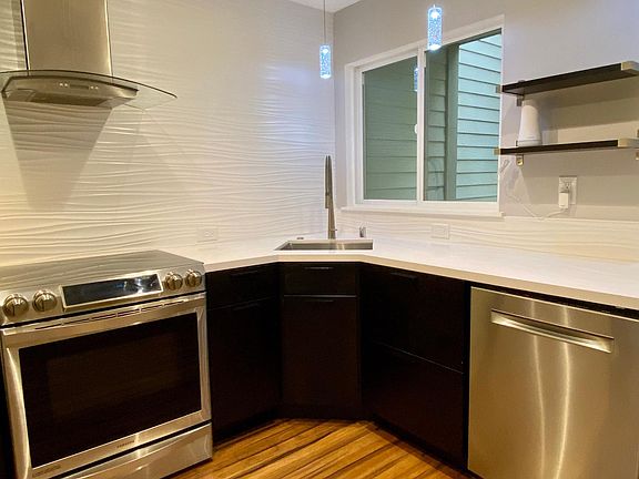 Induction stove, quiet cycle dishwasher, custom tile/light fixtures