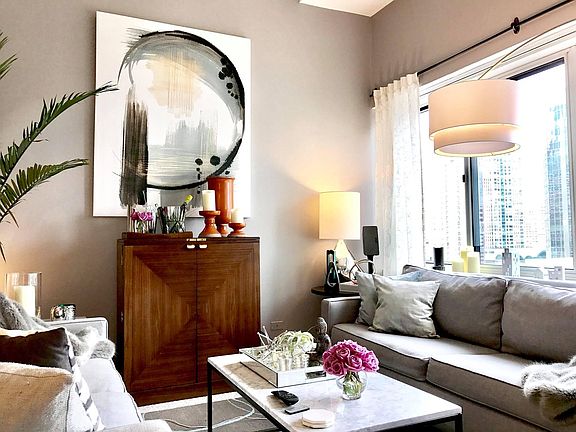 Sky high ceilings enhance the spacious living room