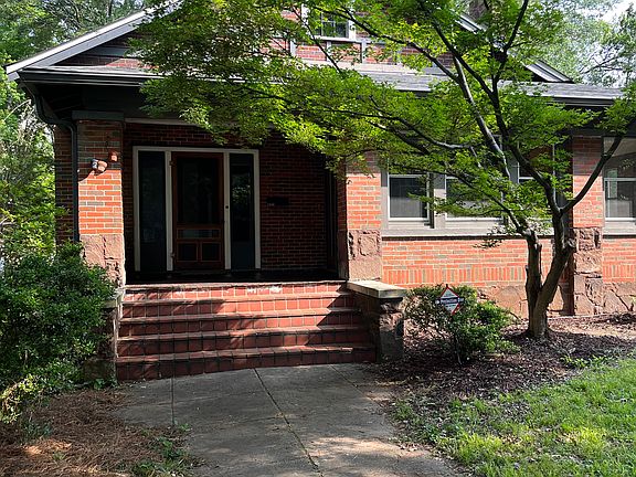 Entry porch. Door to huge wraparound enclosed porch here.