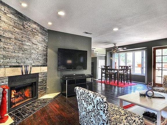 spacious living room area with recess lights