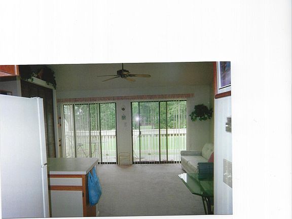 living room with 2 six foot sliders that go out to the balco