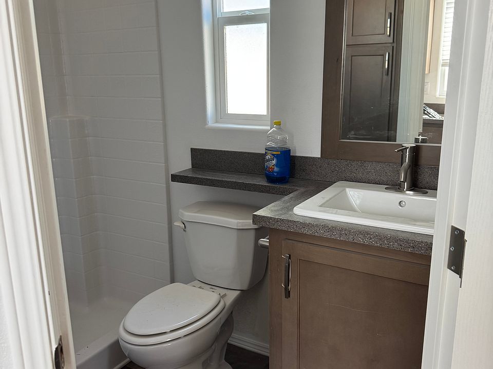 Bathroom with shower and lots of space mini pantry along wall side