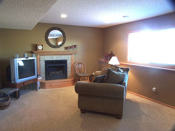 Lower level family room offers a large space and fills with daylight.