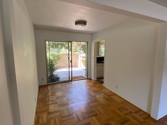 Dining area with patio and glass door to patio, kitchen on the right