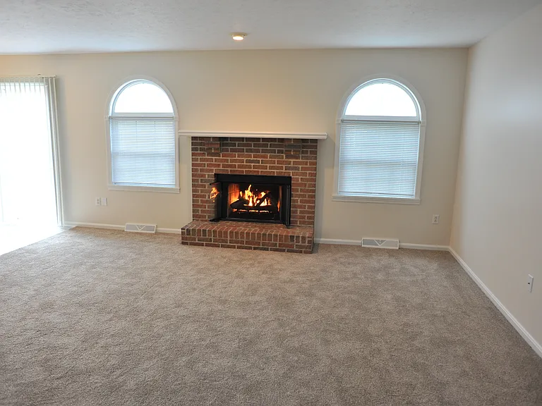 Great room fireplace and sliding door entry
