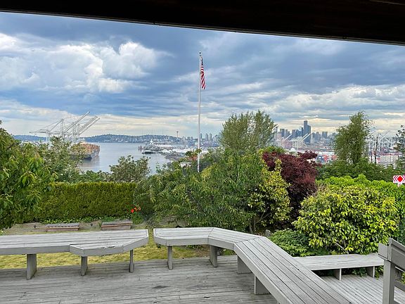 The ever changing view of the West Waterway and the city will be better once the cherries are harvested and the two trees are pruned.