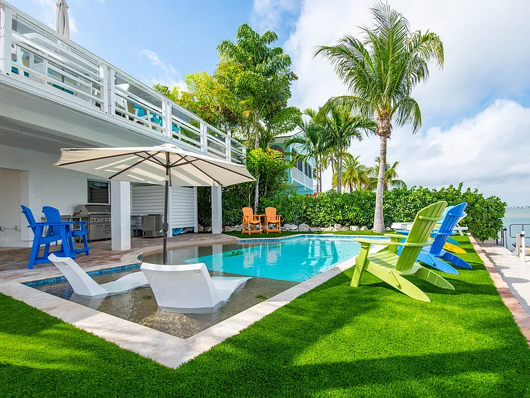 This outdoor space puts the best resorts to shame. The pool has a chiller for the summer and a heater when needed. Lounge chairs on the sun deck under the umbrella are wonderful way to spend time relaxing.