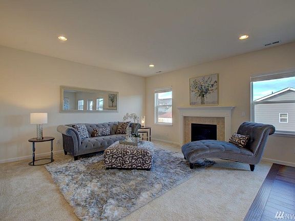 Great room with warm fireplace and lots of light