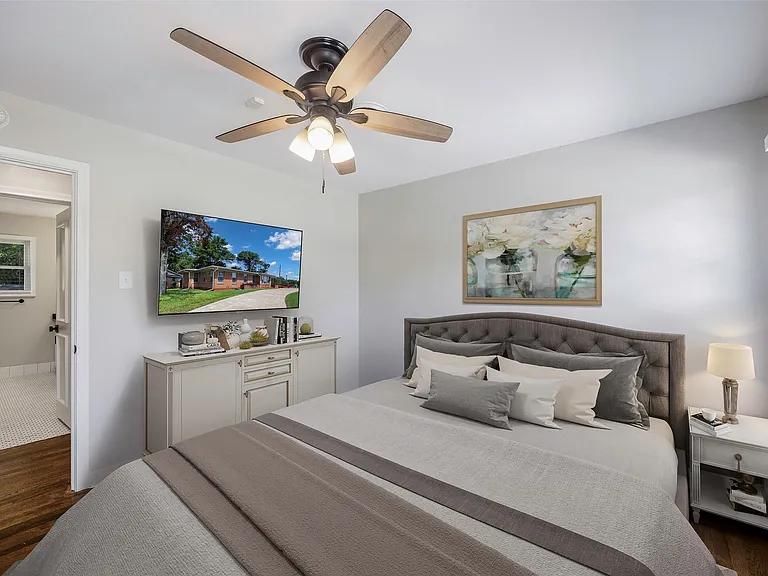 Virtually staged Bedroom with dark wood-type flooring and ceiling fan