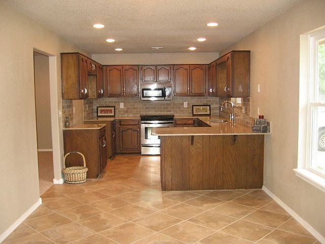 Huge inviting Kitchen with Custom Tile and Granite Countertops