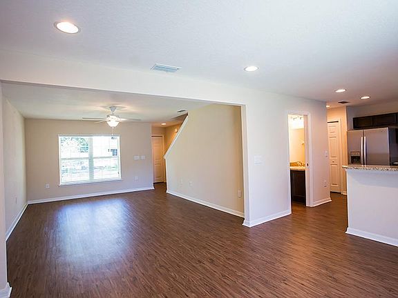 Living room and dining rooms open up to the kitchen
