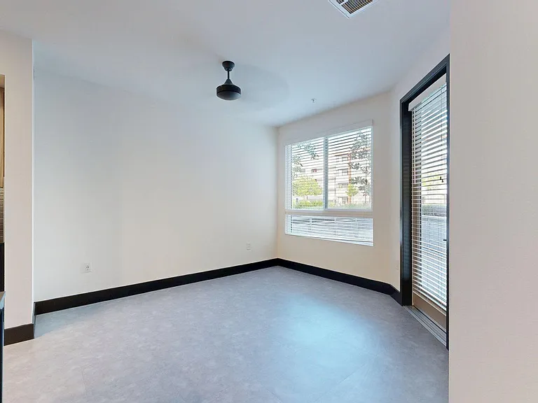 Apartment living room with tile floor.