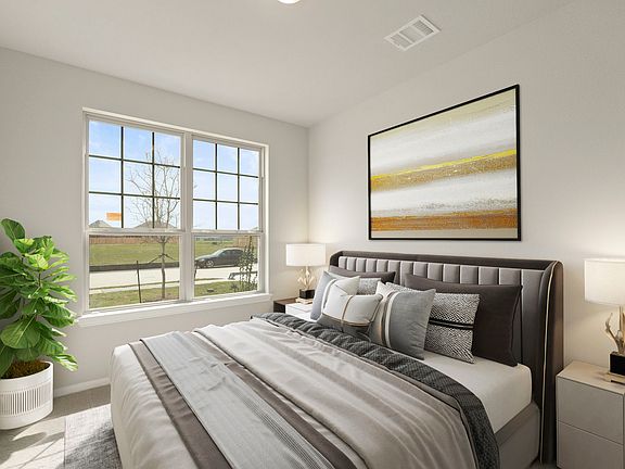 The third bedroom features plush carpet, fresh paint, closet, and a large window that lets in plenty