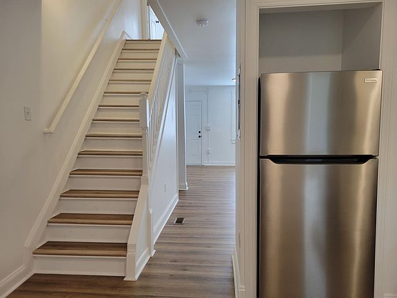 from kitchen view of front door and upstairs