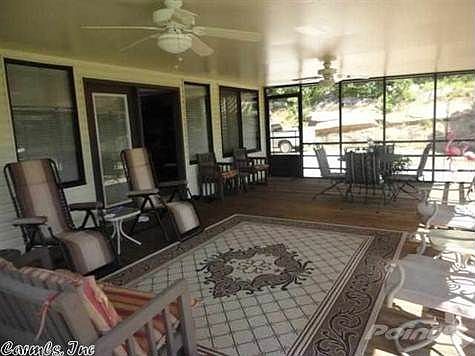 Sit in the sunroom and enjoy view outdoors