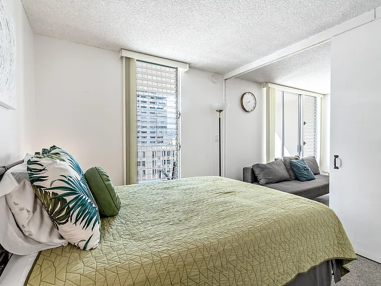 queen bedroom with sliding door off living room